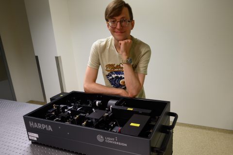 Dr. Kipras Redeckas next to HARPIA transient grating spectrometer that received Gold Honoree in Laser Focus World Innovation Awards 2022